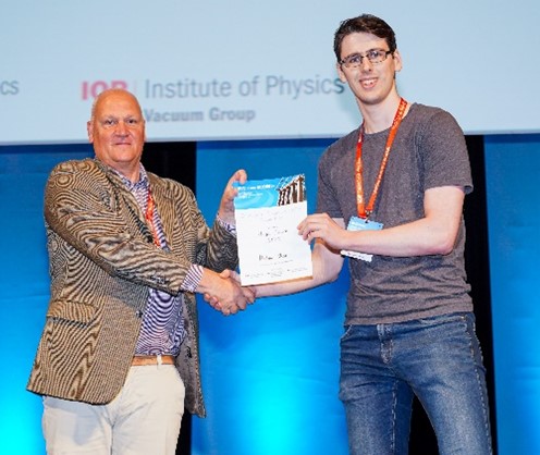   Hugh Churn, ASTeC, receiving a best poster prize